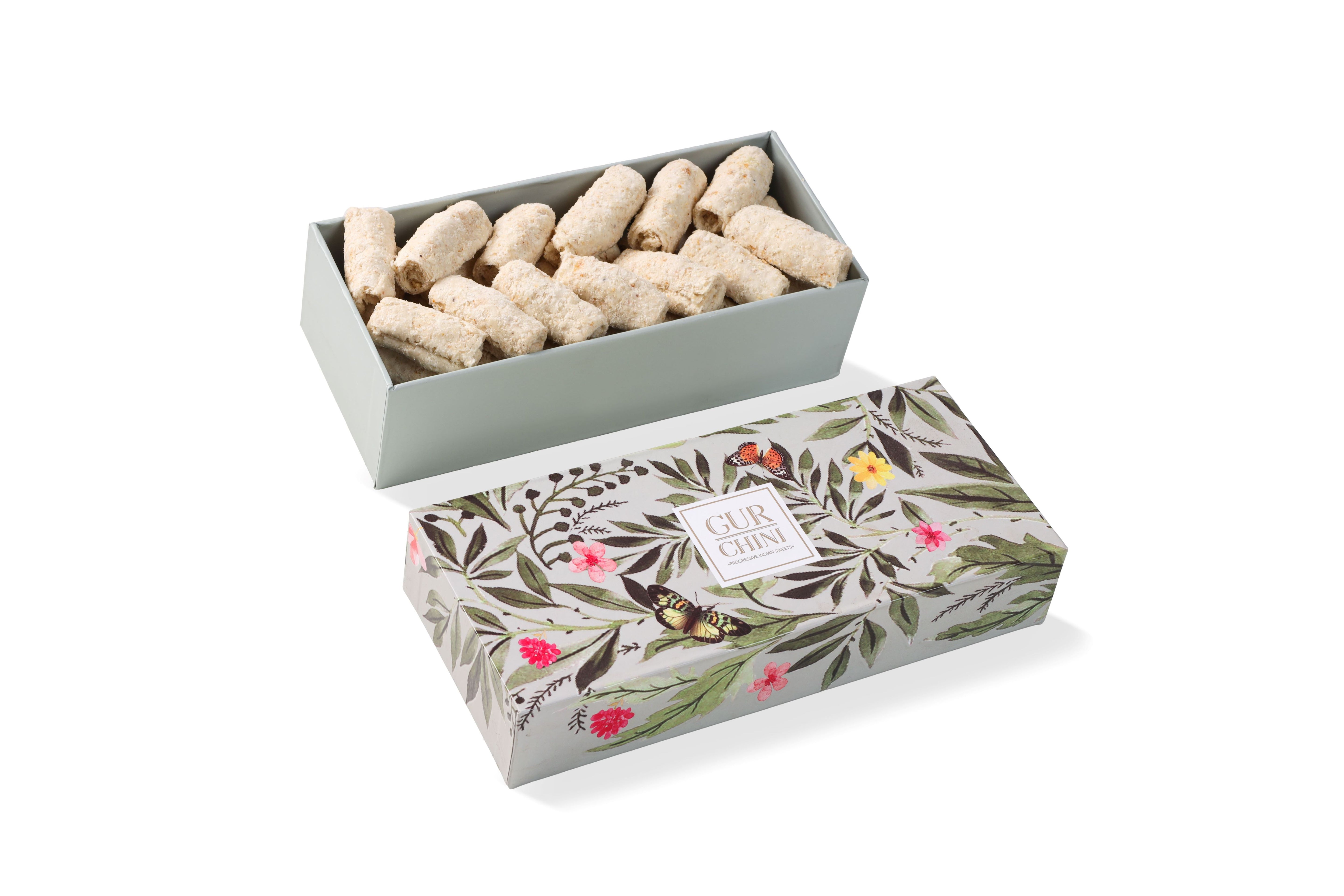 A Green Flower Box of Til Chini Rolls