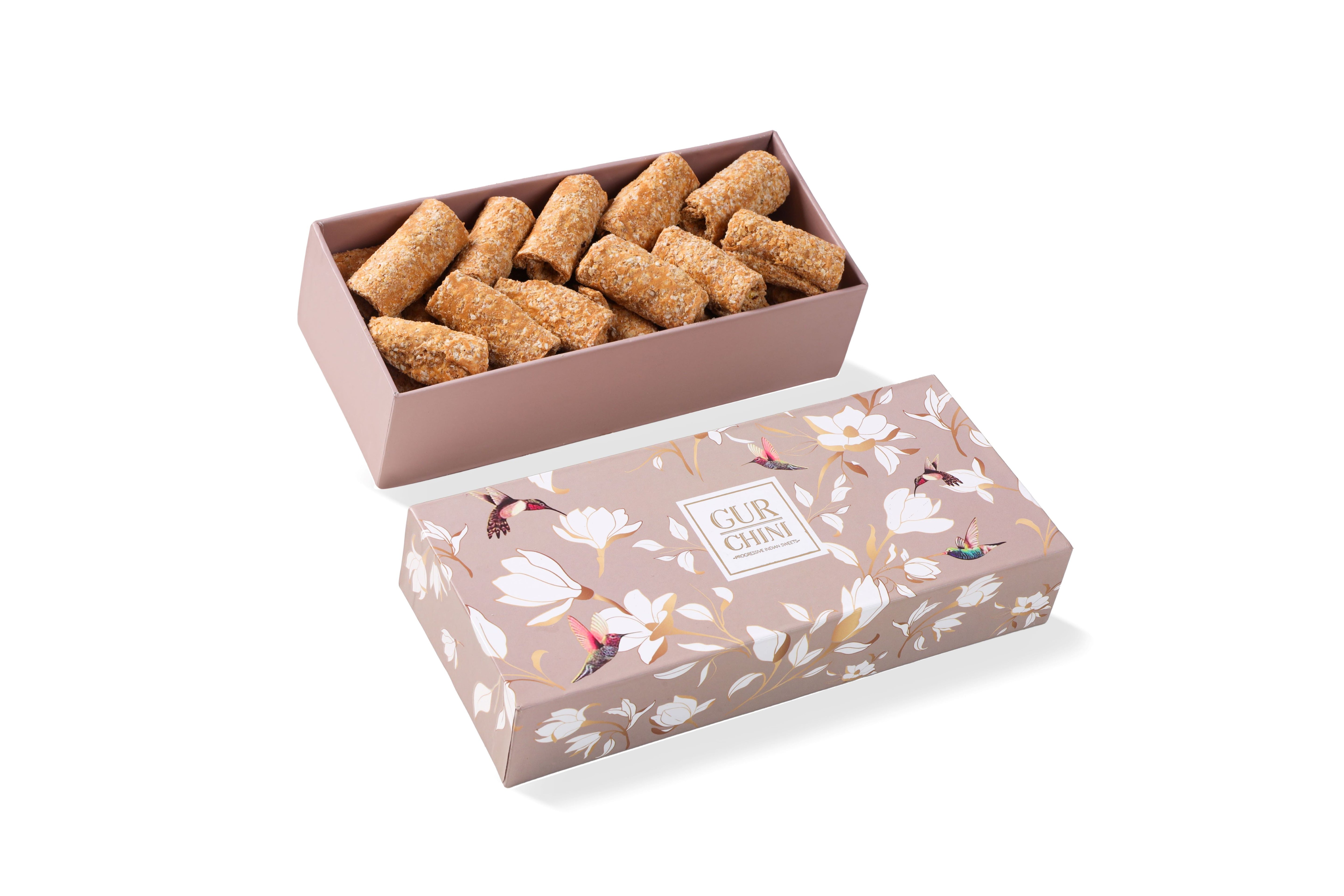 A Brown Flower Box of Til Gur Rolls